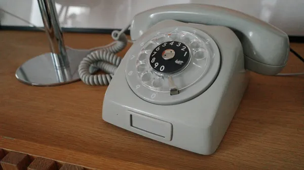 A restored grey rotary telephone containing a Raspberry Pi audio player.